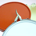 A selection of lids for use with metal pails showing crimp closures and latch lids.